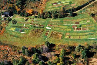 Aerial photo of farm mowed with the words No War